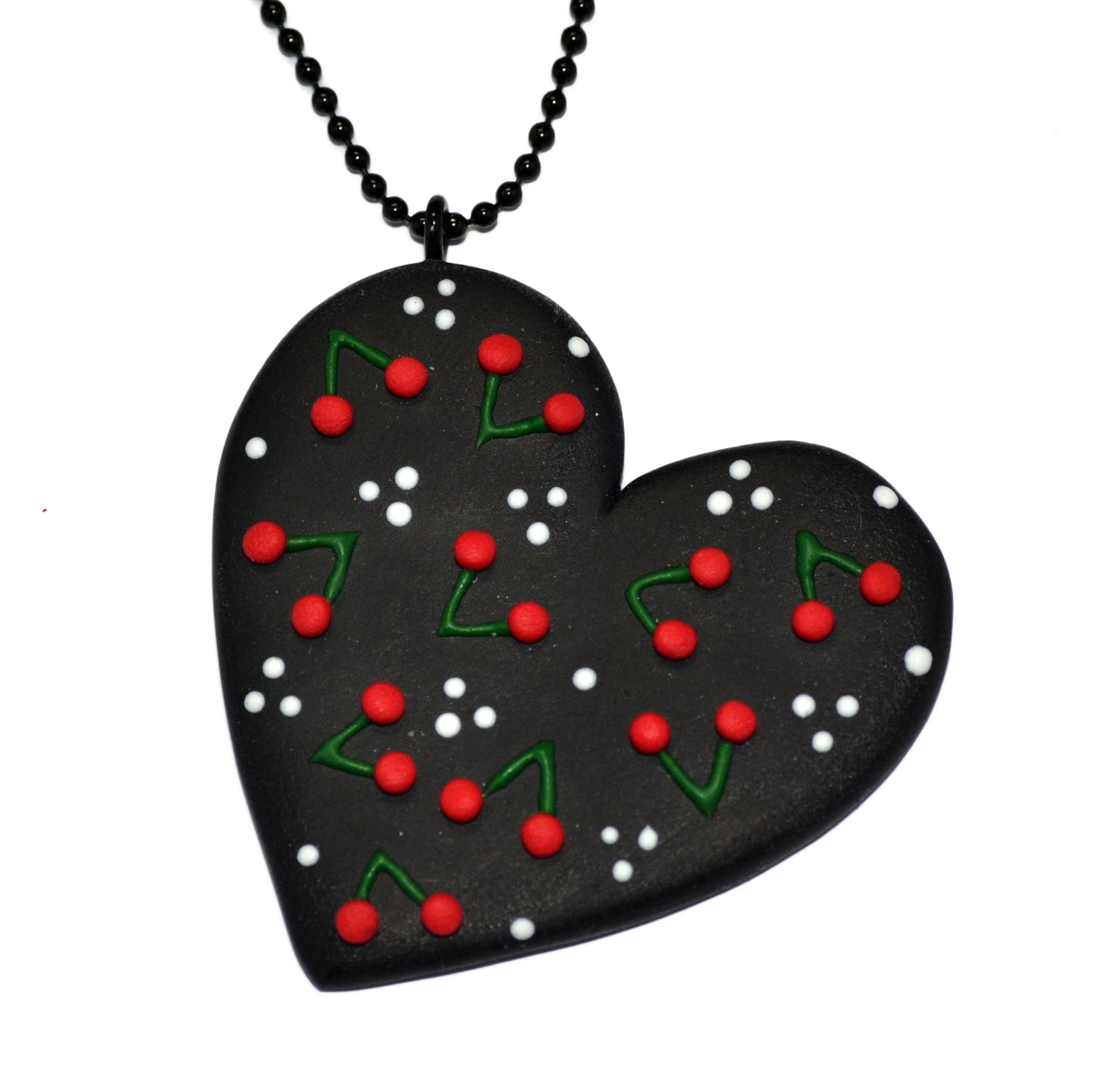 Μακρύ κολιέ μεγάλη καρδιά με κερασάκια σε μαύρο φόντο